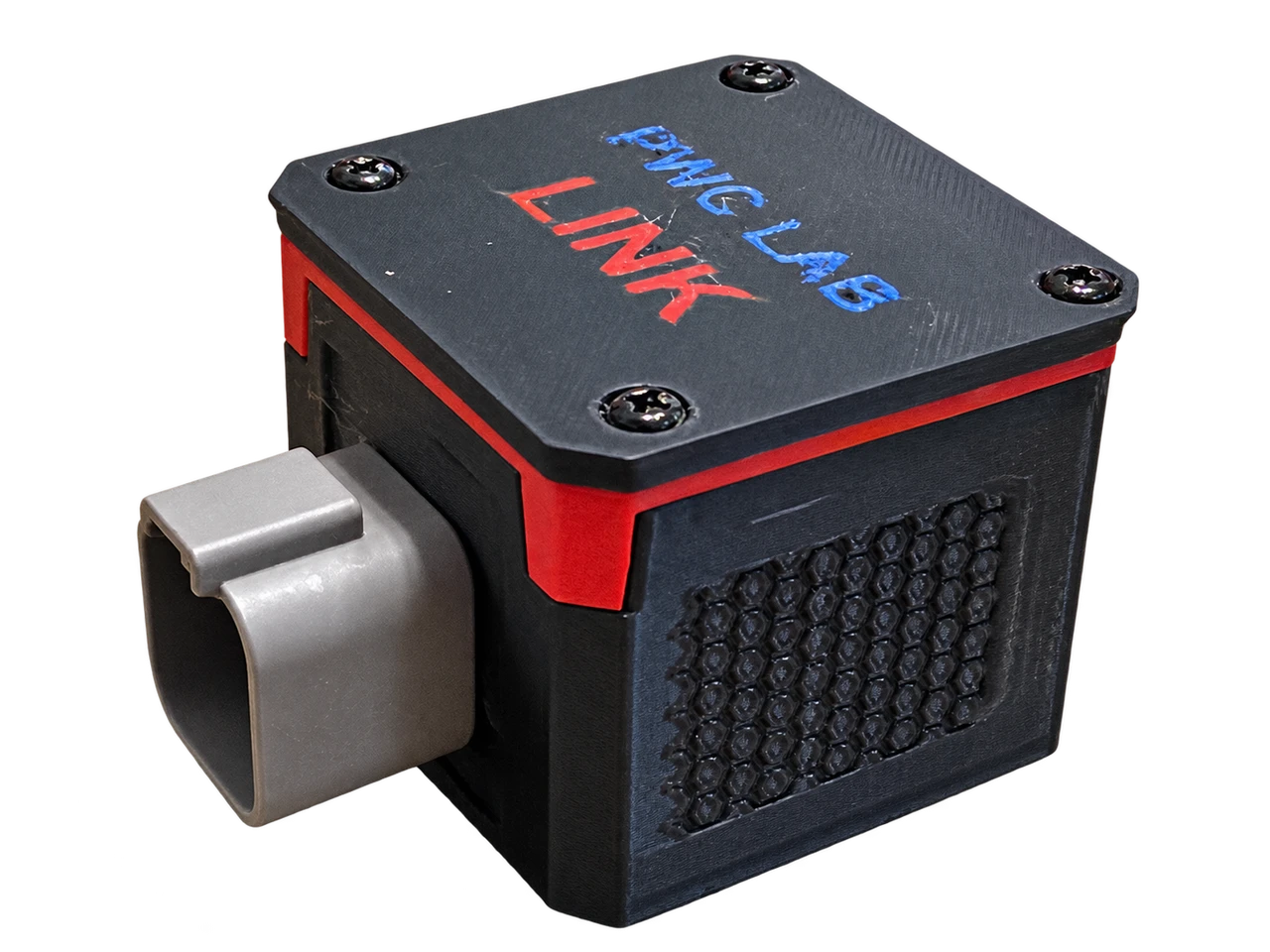 Single-plug PWC LAB Link with its gray connector, red band, textured black enclosure and blue PWC LAB and red LINK lettering